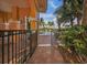 Relaxing pool area with a gate and patio at 157 Tampa E Ave # 407, Venice, FL 34285