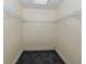 Large walk-in closet with wire shelving and carpeted flooring at 157 Tampa E Ave # 407, Venice, FL 34285