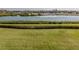 Tranquil waterfront view with boat and lush greenery at 157 Tampa E Ave # 407, Venice, FL 34285