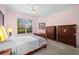 Bright bedroom with a sleigh bed and ample closet space at 1630 Monarch Dr, Venice, FL 34293