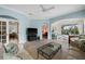 Comfortable living room with multiple seating areas and access to other rooms and outdoor space at 1630 Monarch Dr, Venice, FL 34293