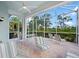 Relaxing screened patio with seating area, perfect for enjoying Florida's outdoors at 1630 Monarch Dr, Venice, FL 34293