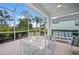 Relaxing screened porch with seating area at 1630 Monarch Dr, Venice, FL 34293
