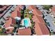Aerial view of community with pool and ample parking at 1640 Stickney Point Rd # 202, Sarasota, FL 34231