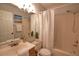 Clean bathroom with shower/tub combo, vanity, and linen closet at 1640 Stickney Point Rd # 202, Sarasota, FL 34231