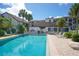 Relaxing community pool area with patio furniture at 1640 Stickney Point Rd # 202, Sarasota, FL 34231
