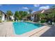 Inviting community pool with surrounding lounge chairs at 1640 Stickney Point Rd # 202, Sarasota, FL 34231