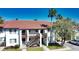 Two-story building with Spanish tile roof and stairs at 1640 Stickney Point Rd # 202, Sarasota, FL 34231