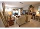 Living room with beige sofas and a view of the patio at 1640 Stickney Point Rd # 202, Sarasota, FL 34231