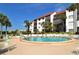 Circular pool with surrounding lounge chairs at 1640 Stickney Point Rd # 202, Sarasota, FL 34231