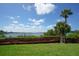 Scenic waterfront view with boardwalk and lush landscaping at 1640 Stickney Point Rd # 202, Sarasota, FL 34231