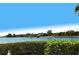 Serene waterfront view with boat passing by at 1640 Stickney Point Rd # 202, Sarasota, FL 34231