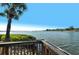Stunning waterfront view from a wooden deck at 1640 Stickney Point Rd # 202, Sarasota, FL 34231