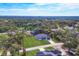 Aerial view of a single Gathering home on a tree-lined street at 16443 Lagore Ave, Port Charlotte, FL 33954