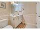 Clean bathroom with white vanity, toilet and bathtub at 1655 Lancashire Dr # 1655, Venice, FL 34293