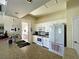 Well-equipped kitchen with white cabinets and appliances at 1655 Lancashire Dr # 1655, Venice, FL 34293