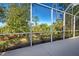 Spacious screened patio overlooking a lush, natural landscape at 1655 Lancashire Dr # 1655, Venice, FL 34293