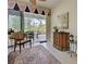 Cozy sunroom with a view of the backyard through sliding glass doors at 1655 Lancashire Dr # 1655, Venice, FL 34293