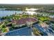 Community clubhouse with adjacent parking and lake views at 19155 Mangieri St, Venice, FL 34293