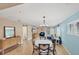 Bright dining area with table and chairs, adjacent to living room at 19155 Mangieri St, Venice, FL 34293