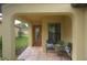 Covered entryway with seating area and a view of the backyard at 19155 Mangieri St, Venice, FL 34293