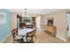 Bright kitchen features a round dining table and modern cabinetry at 19155 Mangieri St, Venice, FL 34293