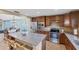 Island kitchen with stainless steel appliances and granite at 19155 Mangieri St, Venice, FL 34293