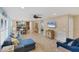 Open living area with comfortable seating and a large TV at 19155 Mangieri St, Venice, FL 34293