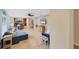 Spacious living room with a sectional sofa and view of the kitchen at 19155 Mangieri St, Venice, FL 34293