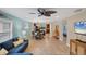 Open concept living area with a sectional sofa and access to the kitchen at 19155 Mangieri St, Venice, FL 34293