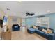 Living area with sectional sofa and coastal decor at 19155 Mangieri St, Venice, FL 34293