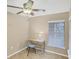 Bright home office features desk and chair near window at 19155 Mangieri St, Venice, FL 34293