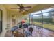 Covered patio features a table, chairs, and grill at 19155 Mangieri St, Venice, FL 34293