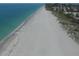 Aerial view of a pristine beach and ocean at 1932 W Isles Rd, Port Charlotte, FL 33953