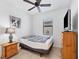 Cozy bedroom with a double bed and wood dresser at 1932 W Isles Rd, Port Charlotte, FL 33953