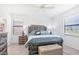 Large bedroom with rustic bed and plenty of natural light at 1932 W Isles Rd, Port Charlotte, FL 33953