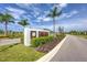 The Isles community entrance with lush landscaping and signage at 1932 W Isles Rd, Port Charlotte, FL 33953