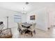 Bright dining room with a large table and chandelier at 1932 W Isles Rd, Port Charlotte, FL 33953