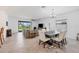 Open concept dining room with view to living room and backyard at 1932 W Isles Rd, Port Charlotte, FL 33953
