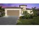 One-story home with attractive landscaping and a two-car garage at 1932 W Isles Rd, Port Charlotte, FL 33953
