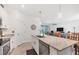 Kitchen island with granite countertops and a breakfast bar at 1932 W Isles Rd, Port Charlotte, FL 33953