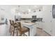 Bright kitchen featuring an island and stainless steel appliances at 1932 W Isles Rd, Port Charlotte, FL 33953