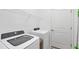 Laundry room with Frigidaire washer and dryer at 1932 W Isles Rd, Port Charlotte, FL 33953