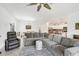 Open living room with large sectional sofa and access to backyard at 1932 W Isles Rd, Port Charlotte, FL 33953