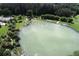 Large community pool with surrounding landscaping at 1932 W Isles Rd, Port Charlotte, FL 33953
