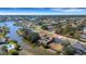 Aerial view of waterfront community showcasing home and canal access at 1985 Fairview Dr, Englewood, FL 34223