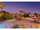 Night view of backyard games and lights at 1985 Fairview Dr, Englewood, FL 34223