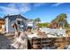 Charming backyard with firepit and unique wood features at 1985 Fairview Dr, Englewood, FL 34223