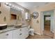 Main bathroom features a stone vessel sink and decorative clock at 1985 Fairview Dr, Englewood, FL 34223