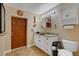 Bathroom with granite vanity and tiled floor at 1985 Fairview Dr, Englewood, FL 34223